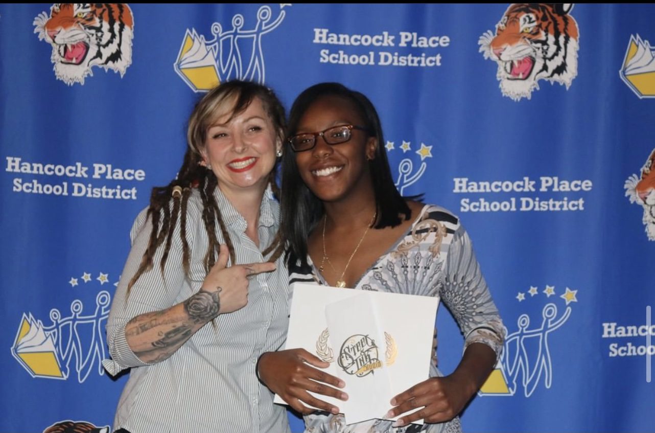 Two Women Posing With The Scholarship Certificate